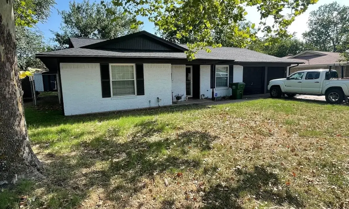 Professional roofing crew working on a residential roof in Farmington